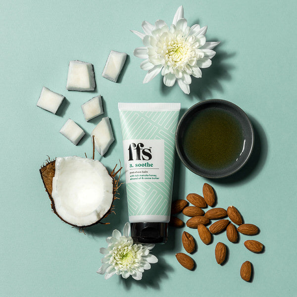 FFS Shave balm surrounded by a pot of manuka honey, almonds, coconut and flowers