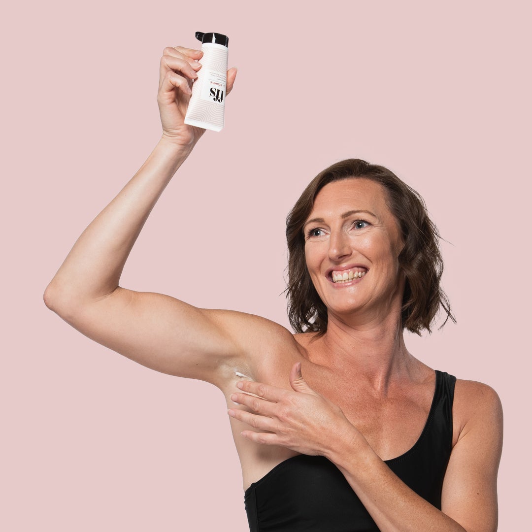 Woman applying FFS shave cream to her armpits